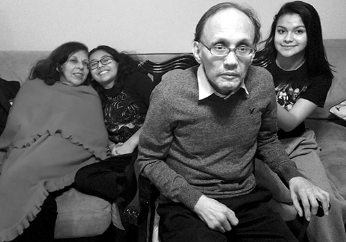 Ivanna sitting with her grandparents as a teenager.
